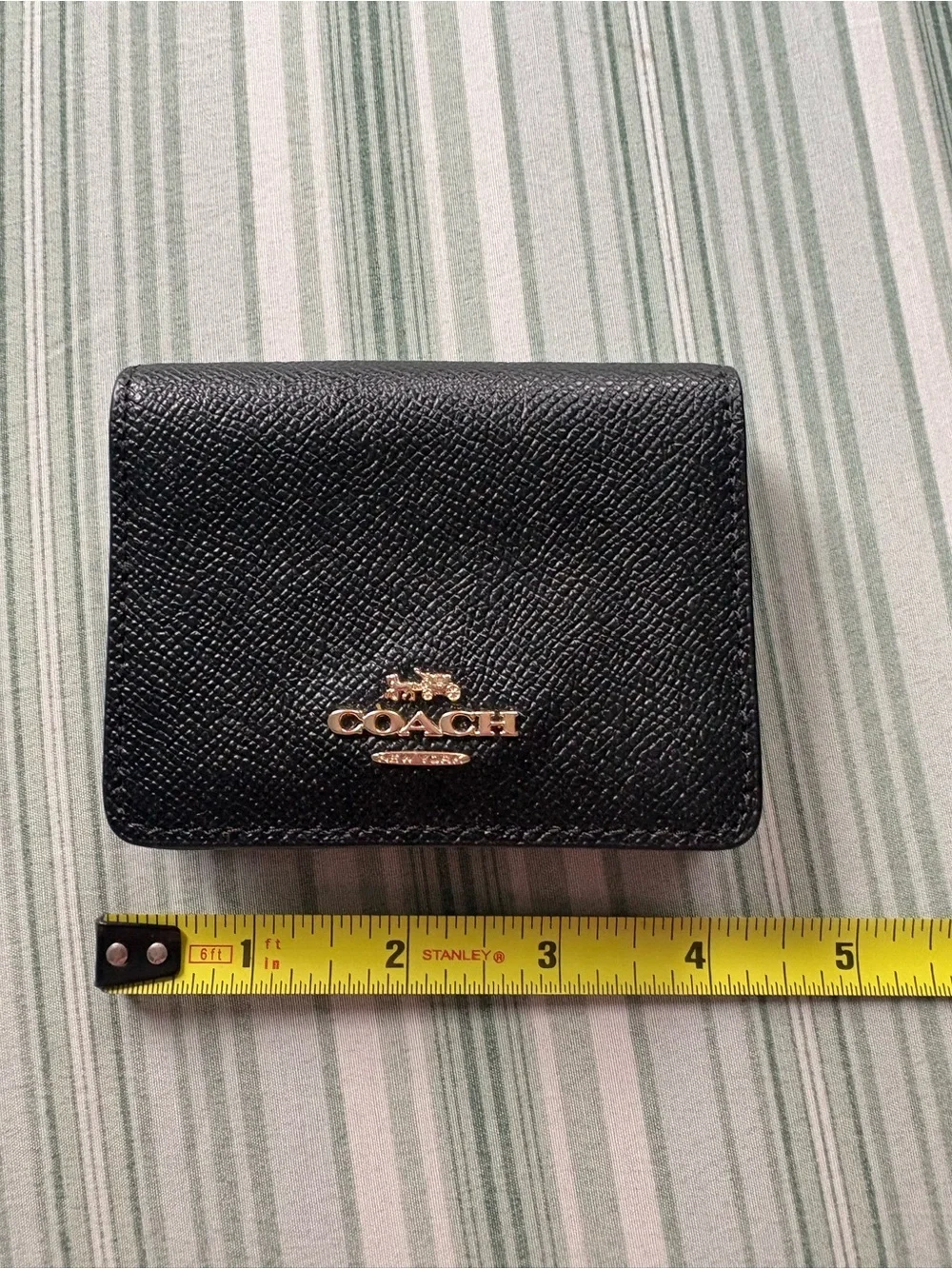 Coach Black Leather Compact Wallet with Gold Logo Accent
